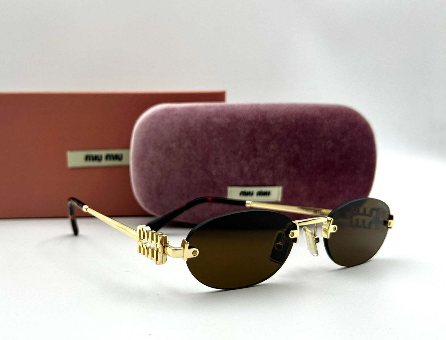 Miu Miu Rimless Oval Sunglasses