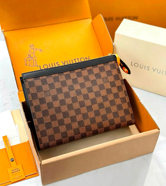 A Louis Vuitton zip-around wallet in the Damier Ebene checkered pattern, presented inside its open original Louis Vuitton box with orange and cream packaging visible.